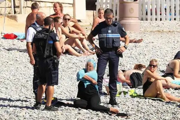 Police force woman to remove her clothing in France